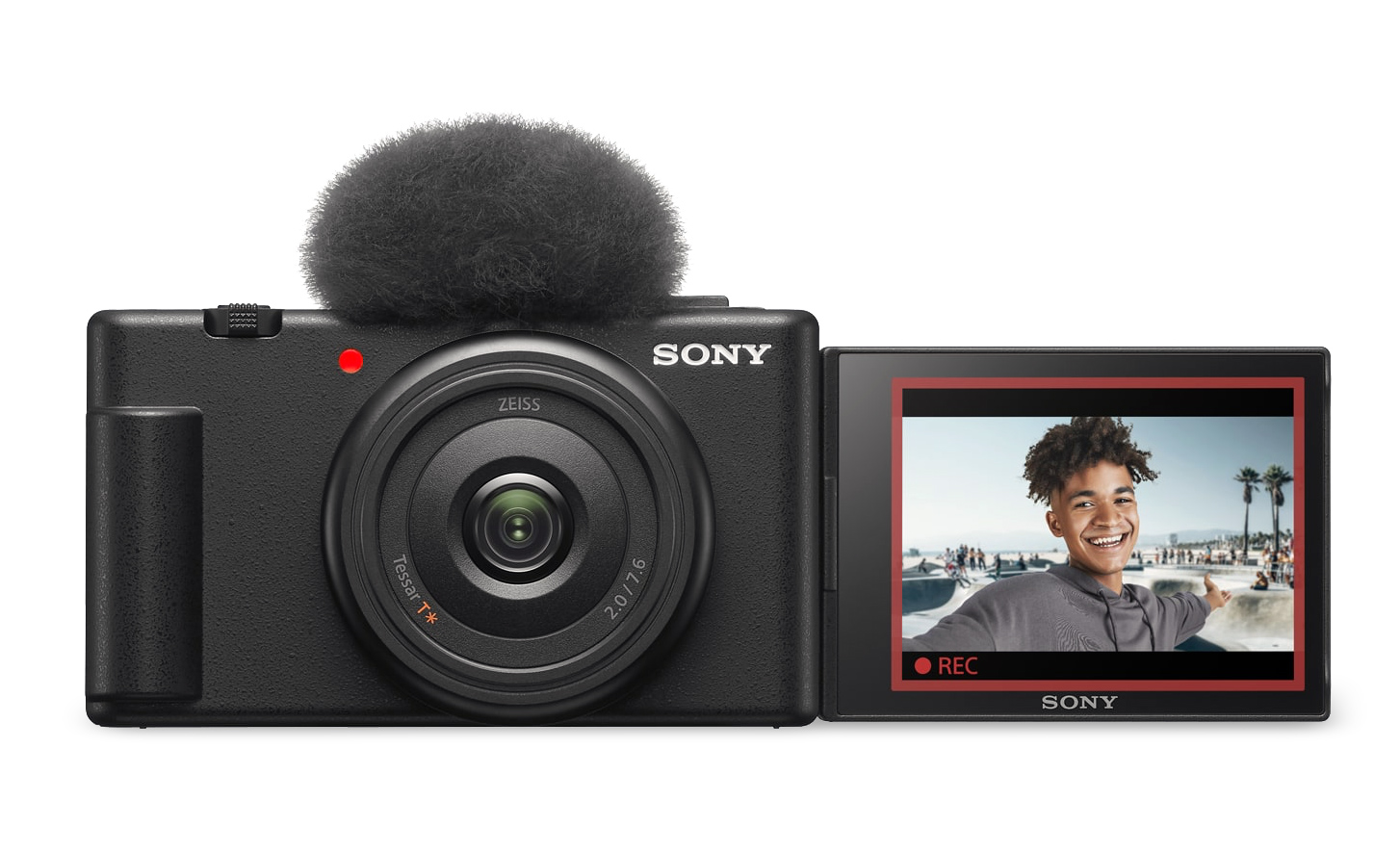 Obrázok kamery ZV-1F s pripojeným krytom proti vetru a otvorenou obrazovkou displeja